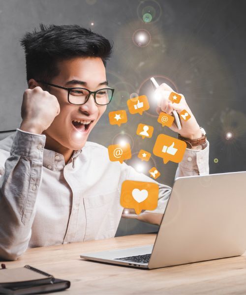 Social Media Manager Excited With Laptop and Emojis